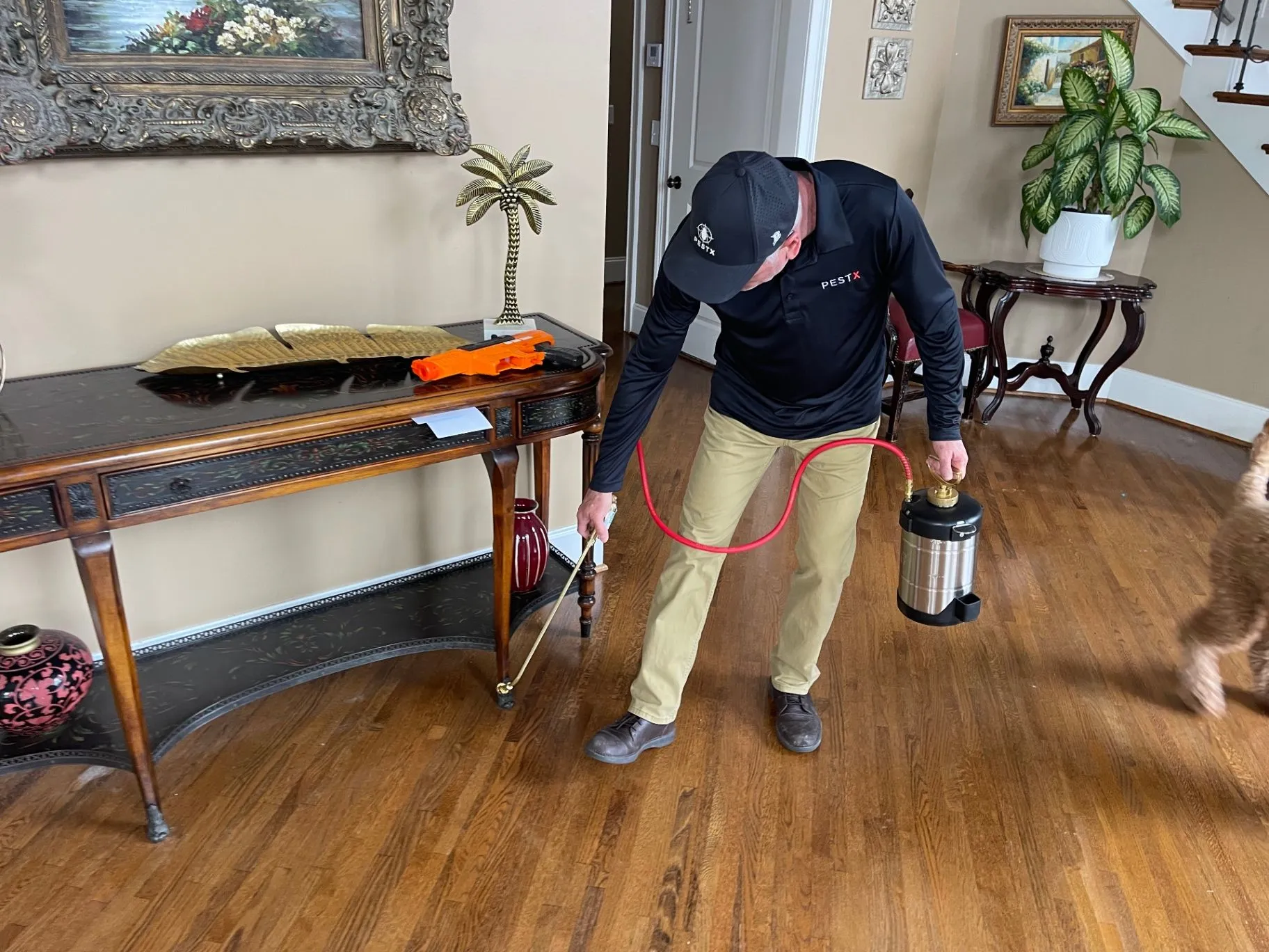 Scott Gilbert applying an interior pest treatment in a Jefferson County, Alabama home. Scott Gilbert applying an interior pest treatment in a Jefferson County, Alabama home.